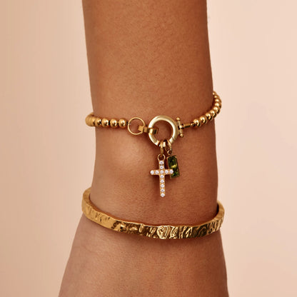 Perlenarmband mit Kreuz-Charm und Geburtsstein